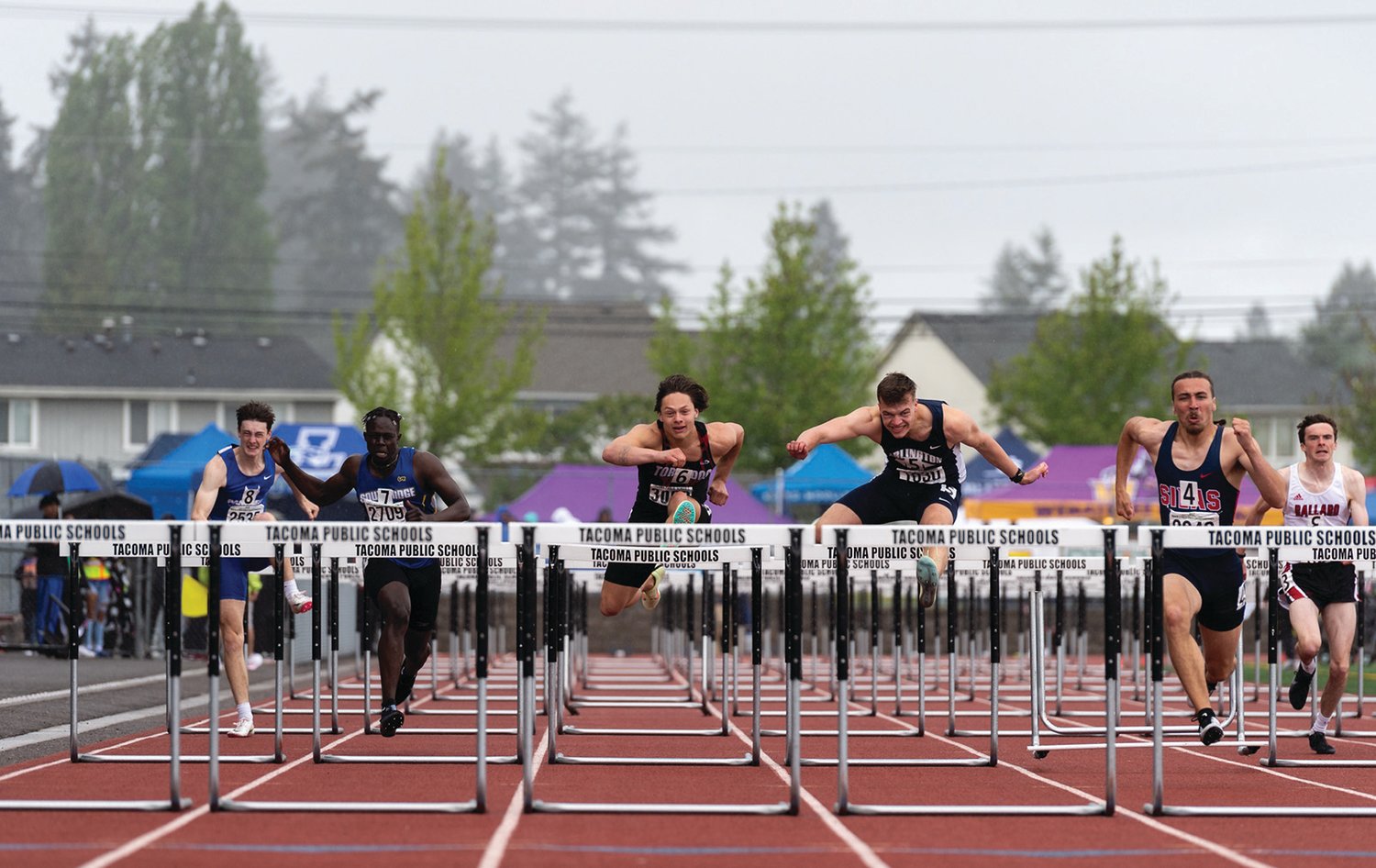Yelm's Kyler Ronquillo, middle, runs in the 3A Boys 110 Hurdles at the 4A/3A/2A State Track and Field Championships on Friday, May 27, 2022, at Mount Tahoma High School in Tacoma. (Joshua Hart/For The Chronicle)